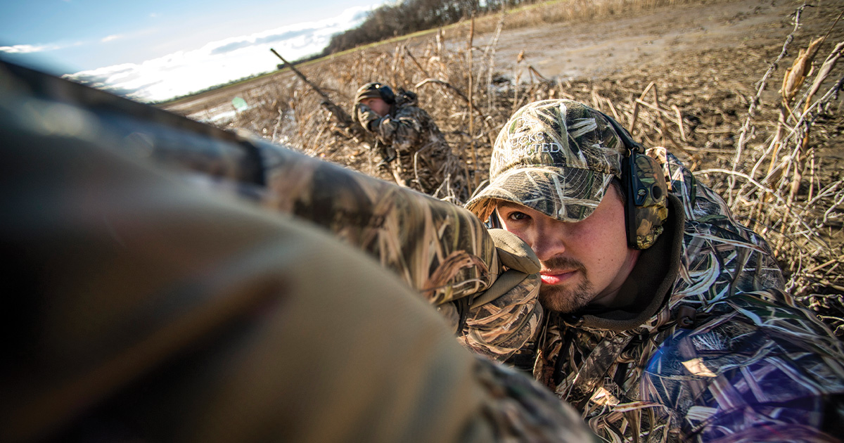 Waterfowl hunter mounted to take a shot. Photo by BillKonway.com